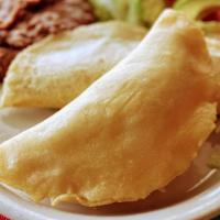 #28 Empanadas Mexicanas · 2 Corn Empanadas Beef, Chicken or Cheese, accompanied with Rice, Beans and Salad