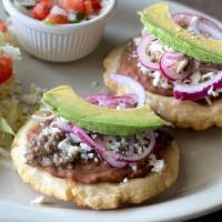 #25.Sopes Plate · 2 Sopes With Beans Beef or Chicken, Queso Fresco, Avocado & Onions Accompanied With Rice and...