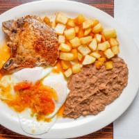 Huevos Rancheros Plate · 2 eggs,beans, potatoes toped w/ ranchero sauce & 2 tortillas