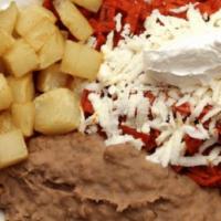 Red Chilaquiles Plate · fried corn strips dressed with house recipe red sauce, onion, queso fresco, sour cream, serv...