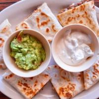 Fiesta Quesadilla  · giant flour quesadilla with your choice of meat sour cream and guacamole