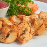 Mild Boneless Chicken Kabob · Perfectly marinated, freshly grilled tender chicken breast, served with basmati rice, chickp...