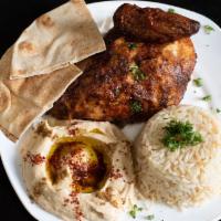 Quarter White Plate · Served with hummus, one garlic spread, rice or pickles and one pita bread.