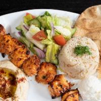 Chicken Kebab Plate · Served with one garlic spread, rice, hummus, salad and one pita bread.