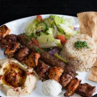 King Combo Plate · One chicken, one beef & one lule kebab skewer. Served with one garlic spread, rice, hummus, ...