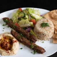Beef Lule Kebab Plate · Served with rice, hummus, salad and one pita bread.