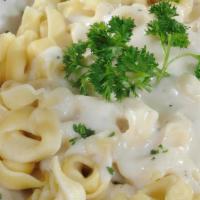 Cheese Tortellini · Cheese stuffed tortellini with your choice of alfredo or marinara sauce a side salad, and ga...