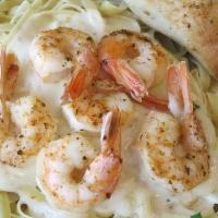 Shrimp Alfredo · Delicious shrimp blended with Alfredo sauce over fettuccine.  Served with a side salad, and ...