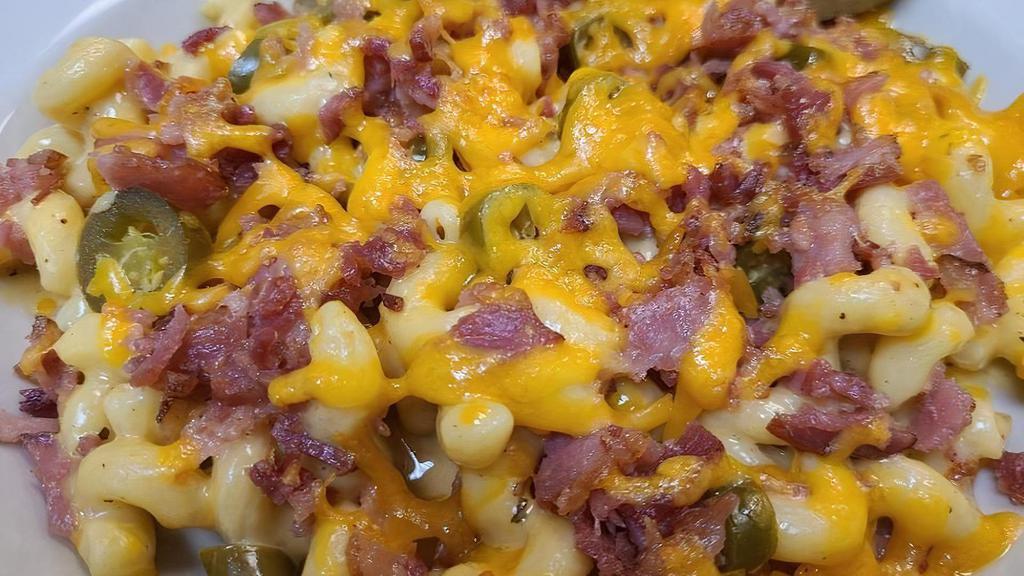 Bacon Jalapeno Mac · Our homemade, rich & creamy cheese. sauce with cavatappi pasta, bacon & jalapenos, a side salad, and garlic roll.