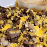 Philly Mac · Our homemade, rich & creamy cheese. sauce with Cavatappi pasta topped with chopped steak,. m...