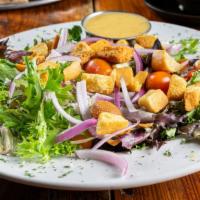 House Salad · Spring mix, local goat cheese, red onions, wood fried bread bites, grape tomatoes, dressing ...