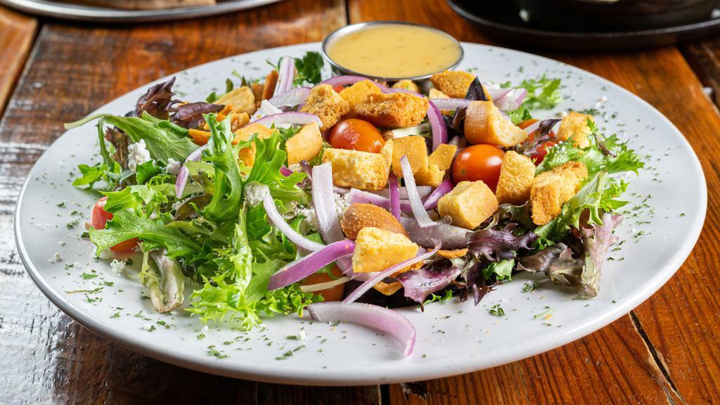 House Salad · Spring mix, local goat cheese, red onions, wood fried bread bites, grape tomatoes, dressing of choice.