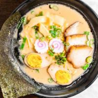 Tonkotsu Ramen · Two piece pork belly, two piece of fishcake, bamboo shoots, one soft boiled egg, seaweed and...