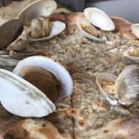 White Clam Pie · Fresh clams, roasted garlic, oregano, Parmesan cheese and white whine sauce.