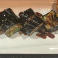 Spider Roll · Soft shell crab, cucumber, avocado, scallion and masago with seaweed outside and sweet eel s...