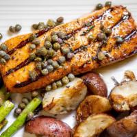 Wild Salmon · Sauteéd salmon, grilled asparagus, herbed roasted potatoes, brown butter caper sauce.