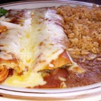 Mole Chicken Enchiladas · 4 corn tortillas filled with chicken lightly deep fried smothered in mole sauce topped with ...
