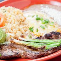 Carne Asada Con Nopales Encebollados/Carne Asada W. Cactus & Onions · served w/ yellow rice, pinto beans, cactus, tortillas, and salad.
 Green and red sauce  is s...