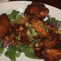 Chicken Wings · Deep fried chicken wings, sweet chili, garlic sauce, green onions.