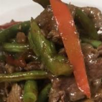 Pad Prik King · Choice of meat, stir fried with green beans, bell peppers, red curry paste and kaffir lime l...