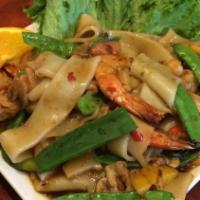 Drunken Noodle · Extra Spicy.  sautéed with wide rice noodles, tomatoes, basil leaves, mushrooms, snow peas a...