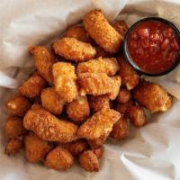 Spicy Cheese Curds · Breaded Wisconsin cheese curds fried crispy. Served with marinara.