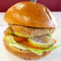 Vegan Crispy Fish Sandwich · Vegan Fish Filet, Lettuce, Tomato, Pickles, Vegan Spicy Aioli (TLS Sauce)