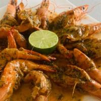 Butterfly Shrimp · Jumbo shrimp sautéed on butter and topped with white creamy sauce