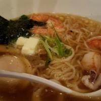 Sapporo Ramen · Chicken broth, shrimp, scallop, squid, soft boiled egg, bamboo shoots, spinach, butter, and ...