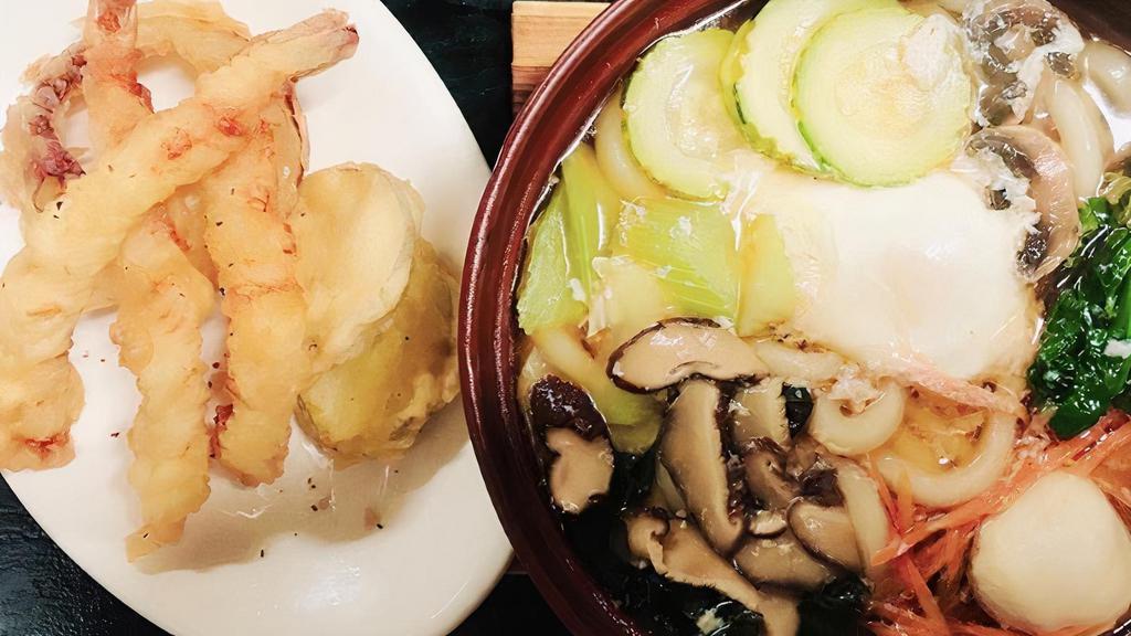 Nabeyaki Udon · Seafood broth with vegetable and poached egg and side of shrimp and vegetable tempura.