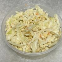 Coleslaw · Finely hand shredded cabbage w/ homemade dressing.