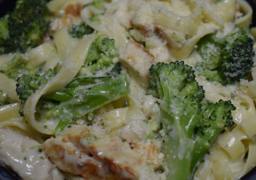 Chicken & Broccoli Fettuccini Alfredo · Our Fettuccini Noodles, Fresh Seasoned grilled Chicken w/Alfredo Sauce. Serve With 2pc Of Garlic Bread