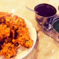 Vegetable Pakoras · 5 pieces fresh vegetable fritters made with spinach, onion, potatoes and cauliflower.