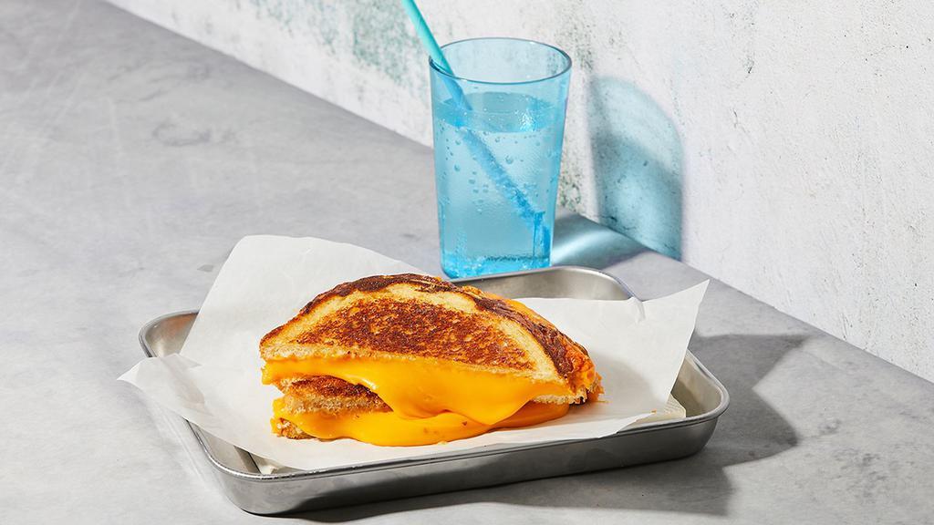 The Classic · Melted American cheese grilled between two slices of buttered bread.