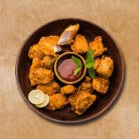 Chicken Forge Fritter · Crispy fried chicken fritter made with gram flour, ginger garlic & spice, and herbs.