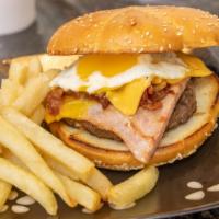 Brunck Burger · Ham, bacon, cheese, beef patty on brioche bun.
