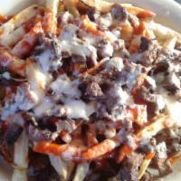 Carne Asada Fries · French Fries topped with carne asada, red chile sauce, and cheese.