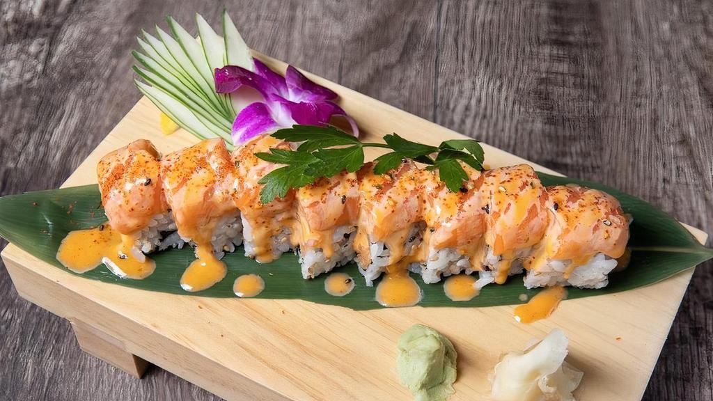 Alaskan Beauty Roll* · Spicy Salmon and Tempura Flakes inside, topped with Salmon, Chili Pepper and Spicy Mayo Sauce