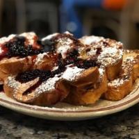 French Toast · cinnamon dipped challah bread or powdered sugar.