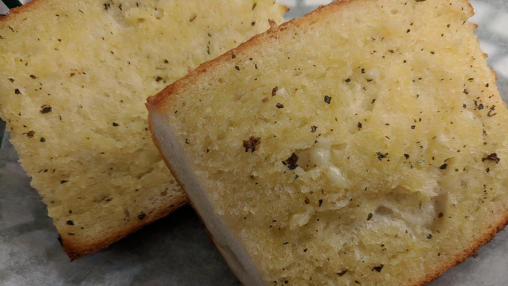 Garlic Bread · Garlic butter Parmesan spread on Italian bread.