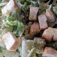 Caesar · Crisp romaine lettuce tossed with dressing, Parmesan and our homemade croutons.