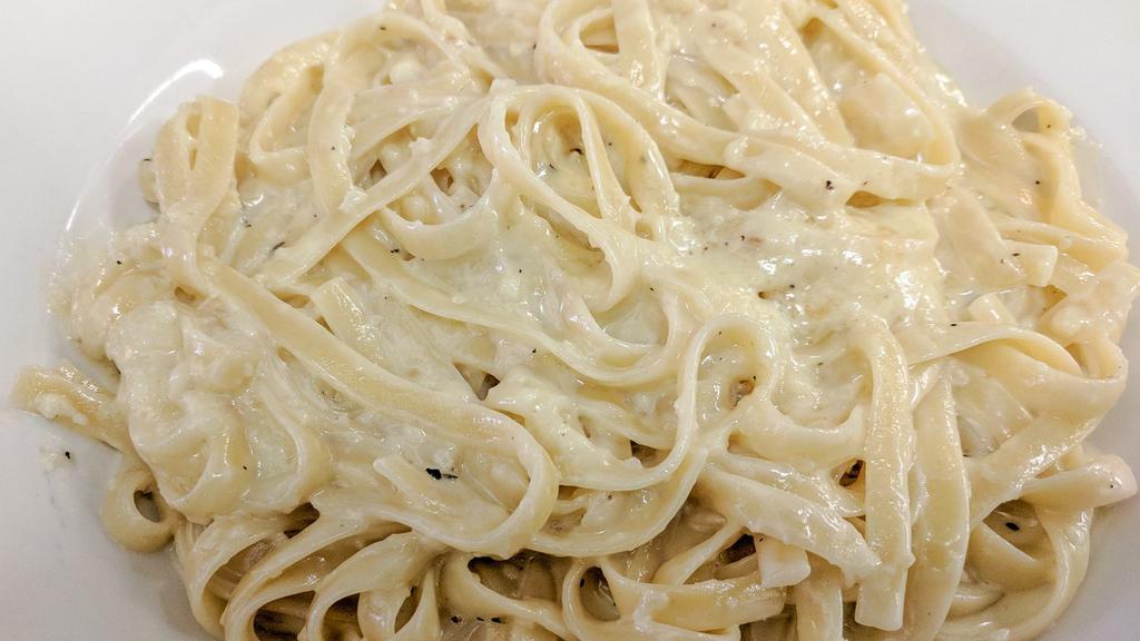 Fettuccini Romano · Sautéed olive oil and garlic in a creamy butter, Parmesan sauce and tossed with fettuccini pasta.