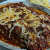 Lasagne Emiliana (Signature Dish) · Northern Italian style lasagna, layered with fresh spinach pasta, shredded beef loin, sausag...