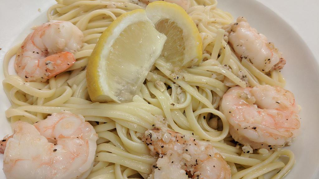 Linguini Con Gamberi · Large shrimp sautéed with olive oil and garlic in a white wine, butter, and lemon sauce, tossed with Italian parsley and linguini.