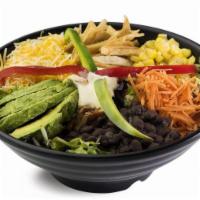The Taco Salad · Romaine, diced chicken, black beans, sweet corn, green and red peppers, shredded carrots, av...