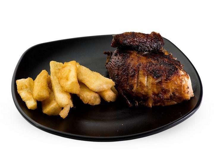 Kids Rotisserie Chicken (One Side) · A quarter piece of our Peruvian rotisserie chicken, served with one side and 2 sauces.