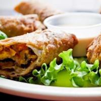 Southwest Eggrolls · Diced chicken breast rolled with black beans, corn, spinach and red bell pepper. Chipotle ra...