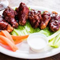 Jumbo Wings · Breaded wings, BBQ or buffalo style, with celery and carrot sticks. Bleu cheese or ranch dre...
