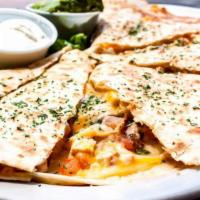 Chicken Quesadilla · Tortilla stuffed with grilled or blackened chicken, cheese and pico de gallo. Sour cream and...