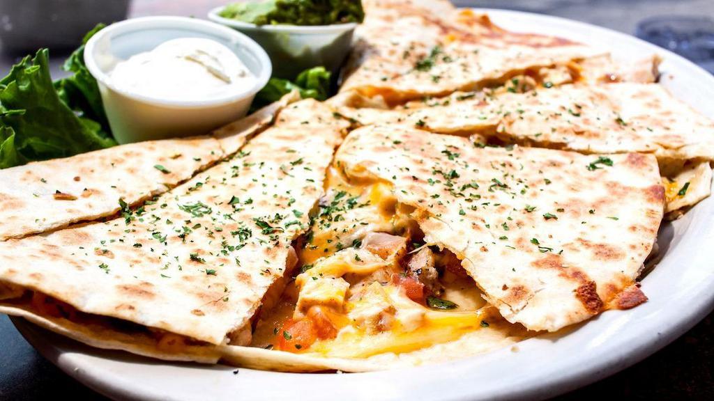 Chicken Quesadilla · Tortilla stuffed with grilled or blackened chicken, cheese and pico de gallo. Sour cream and guacamole on the side.